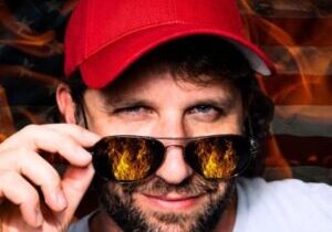 Man with sunglasses and red cap